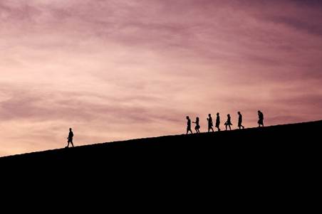Leadership showing a team being led by someone - the difference between I and We